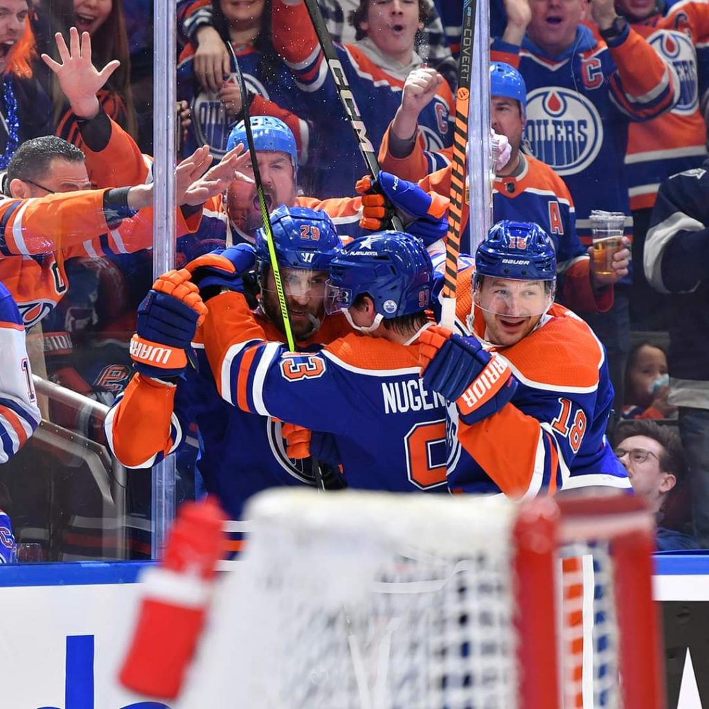 EDMONTON, CANADA - MAY 01: Leon Draisaitl #29 of the Edmonton Oilers celebrates his second goal of the game in the second period against the Los Angeles Kings with teammates Zach Hyman #18 and Ryan Nugent-Hopkins #93 in Game Five of the First Round of the 2024 Stanley Cup Playoffs at Rogers Place on May 1, 2024, in Edmonton, Alberta, Canada. (Photo by Andy Devlin/NHLI via Getty Images)