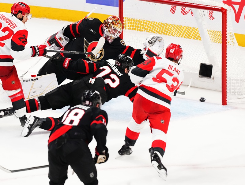 Carolina Hurricanes' Jackson Blake (53) scores on Ottawa Senators goaltender Linus Ullmark (35) as Senator's Thomas Chabot (72) defends during the second period of an NHL hockey playoff game in Ottawa, Ontario, Thursday, April 23, 2026. (Sean Kilpatrick/The Canadian Press via AP)